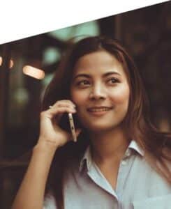 stock image of woman talking on the phone for a blog about how a facelift could save your job in NY, NY