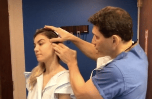 Dr Miller of Gotham Plastic Surgery New York demonstrates the ponytail microlift with his patient.