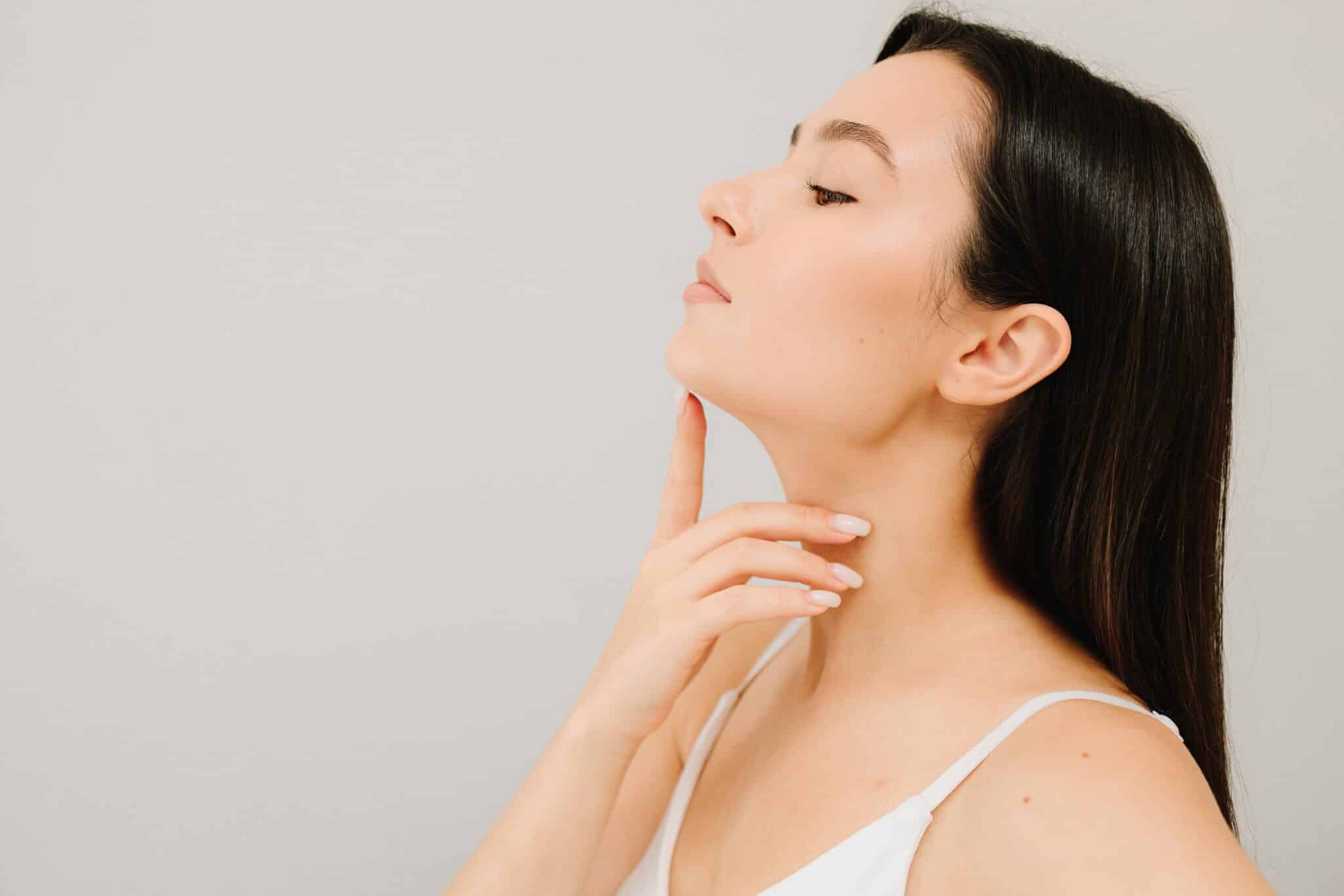 woman touching her chin